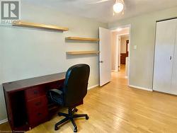 Office space featuring ceiling fan and light hardwood / wood-style flooring - 