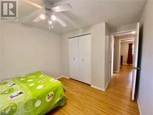 Unfurnished bedroom with light hardwood / wood-style floors, a closet, and ceiling fan - 531 Brookhaven Crescent Unit# A, Waterloo, ON - Indoor Photo Showing Bedroom