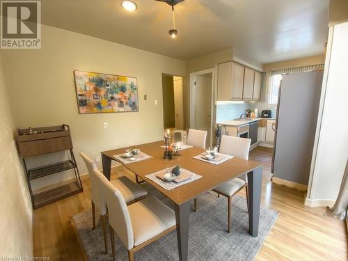 Dining area featuring light hardwood / wood-style flooring and sink - 531 Brookhaven Crescent Unit# A, Waterloo, ON - Indoor Photo Showing Dining Room