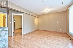 Spare room featuring light wood-type flooring - 