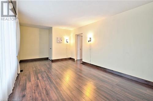 Spare room featuring dark hardwood / wood-style flooring - 1476 Barton Street E, Hamilton, ON - Indoor Photo Showing Other Room