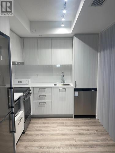 318 - 195 Commerce Street, Vaughan, ON - Indoor Photo Showing Kitchen With Stainless Steel Kitchen With Double Sink