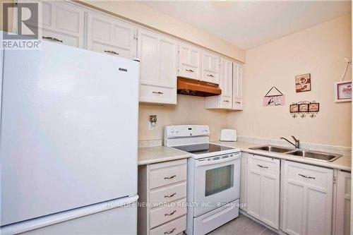 Upper - 40 Kennaley Avenue, Toronto, ON - Indoor Photo Showing Kitchen With Double Sink