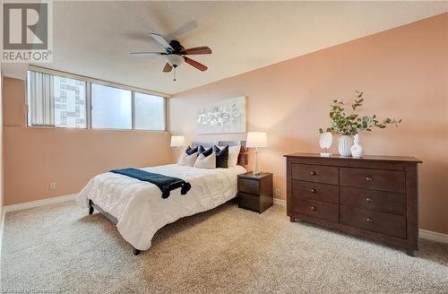 Primary Bedroom featuring light carpet and ceiling fan - 375 King Street N Unit# 503, Waterloo, ON - Indoor Photo Showing Bedroom