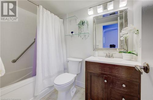 Full bathroom featuring tile patterned flooring, shower / tub combo with curtain, vanity, and toilet - 375 King Street N Unit# 503, Waterloo, ON - Indoor Photo Showing Bathroom