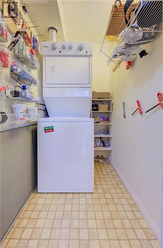 Laundry room featuring stacked washer / dryer - 375 King Street N Unit# 503, Waterloo, ON - Indoor Photo Showing Laundry Room