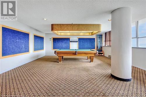 Playroom featuring a textured ceiling, carpet floors, and billiards - 375 King Street N Unit# 503, Waterloo, ON - Indoor Photo Showing Other Room