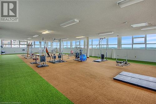 Workout area with carpet flooring and a textured ceiling - 375 King Street N Unit# 503, Waterloo, ON - Indoor Photo Showing Gym Room