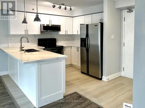 303 - 16 Westbury Road S, Wasaga Beach, ON - Indoor Photo Showing Kitchen With Double Sink