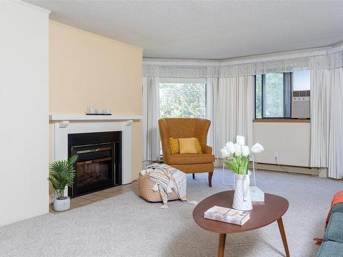 304-1560 Hillside Ave, Victoria, BC - Indoor Photo Showing Living Room With Fireplace