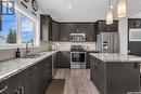 311 Delainey Manor, Saskatoon, SK  - Indoor Photo Showing Kitchen With Double Sink With Upgraded Kitchen 