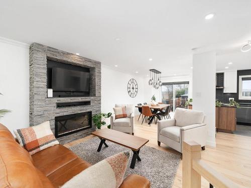 Living room - 6179 Rue Des Mûriers, Longueuil (Saint-Hubert), QC - Indoor Photo Showing Living Room With Fireplace