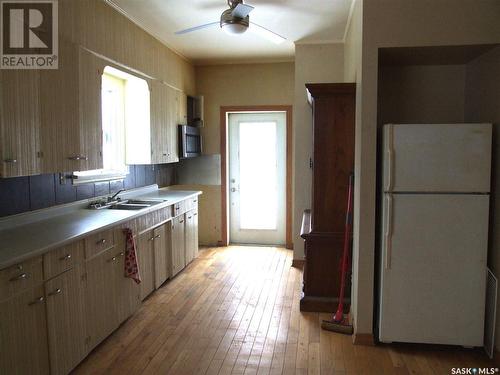 250 1St Street E, Leader, SK - Indoor Photo Showing Kitchen With Double Sink