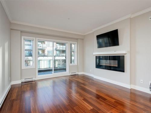 201-9776 Fourth St, Sidney, BC - Indoor Photo Showing Living Room With Fireplace