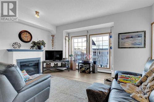 2460, 151 Country Village Road Ne, Calgary, AB - Indoor Photo Showing Living Room With Fireplace