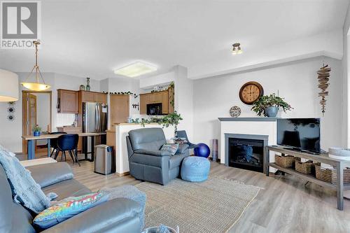 2460, 151 Country Village Road Ne, Calgary, AB - Indoor Photo Showing Living Room With Fireplace