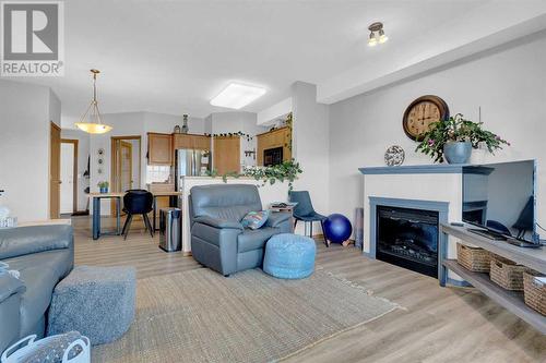 2460, 151 Country Village Road Ne, Calgary, AB - Indoor Photo Showing Living Room With Fireplace