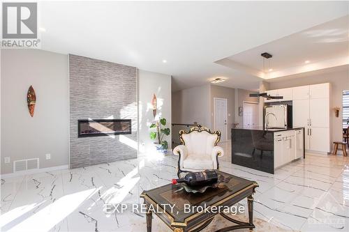 65 Granite Street, Clarence-Rockland, ON - Indoor Photo Showing Living Room With Fireplace