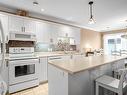 Kitchen - 404-225 Rue Bohémier, Mascouche, QC  - Indoor Photo Showing Kitchen With Double Sink 