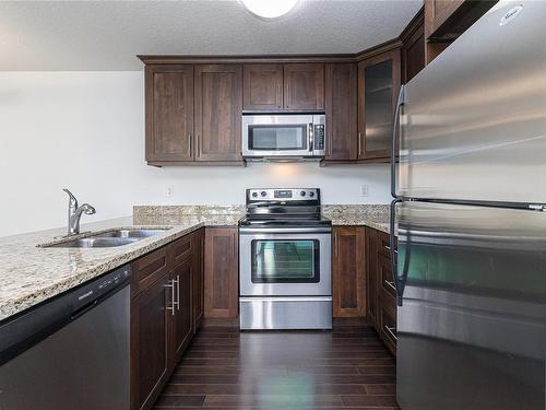 202-257 Moilliet St South, Parksville, BC - Indoor Photo Showing Kitchen With Double Sink