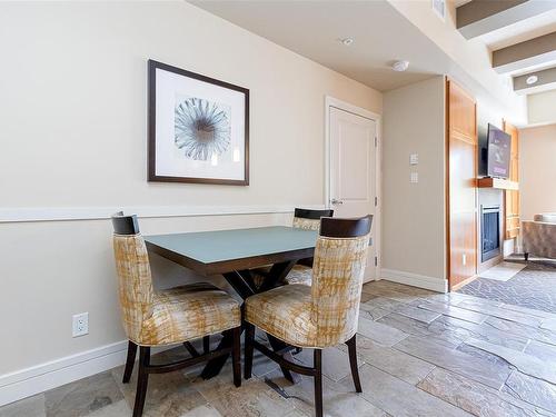 306/308 C-1376 Lynburne Pl, Langford, BC - Indoor Photo Showing Dining Room With Fireplace