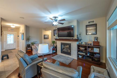 19-6823 Tucelnuit Drive, Oliver, BC - Indoor Photo Showing Living Room With Fireplace