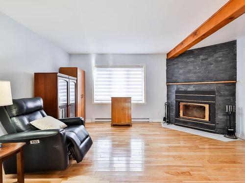 Salon - 114 Rue St-Joseph, Sainte-Thérèse, QC - Indoor Photo Showing Living Room With Fireplace