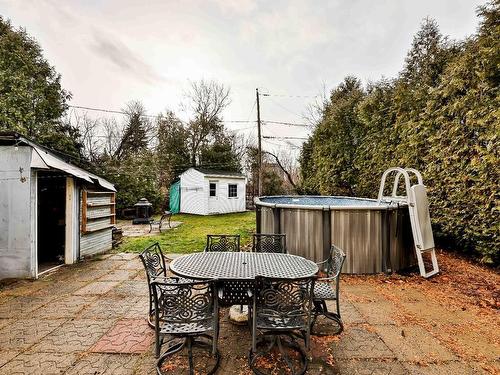 Piscine - 114 Rue St-Joseph, Sainte-Thérèse, QC - Outdoor With Above Ground Pool