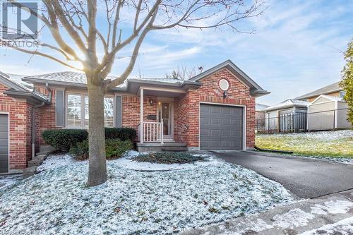 Ranch-style house featuring a garage - 529 Nova Scotia Court Unit# 18, Woodstock, ON - Outdoor