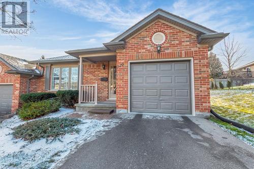 Front facade featuring a garage - 529 Nova Scotia Court Unit# 18, Woodstock, ON - Outdoor