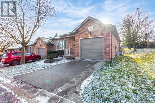 View of front of house with a garage - 529 Nova Scotia Court Unit# 18, Woodstock, ON - Outdoor