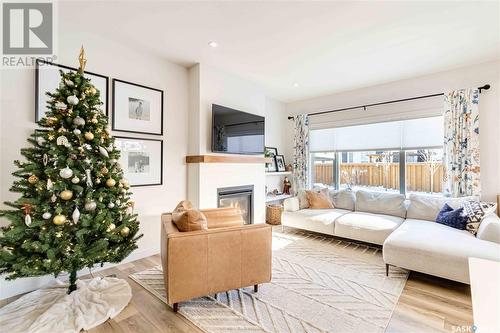 246 Stilling Union, Saskatoon, SK - Indoor Photo Showing Living Room With Fireplace