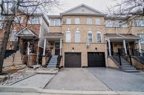 View of property featuring a garage - 1480 Britannia Road W Unit# 143, Mississauga, ON - Outdoor With Facade