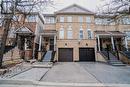 View of property featuring a garage - 1480 Britannia Road W Unit# 143, Mississauga, ON  - Outdoor With Facade 