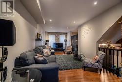 Living room with light wood-type flooring - 