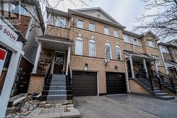 View of property featuring a garage - 