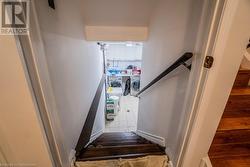 Staircase featuring washer and dryer and tile patterned floors - 