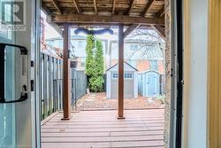 Entryway featuring wood ceiling and hardwood / wood-style flooring - 