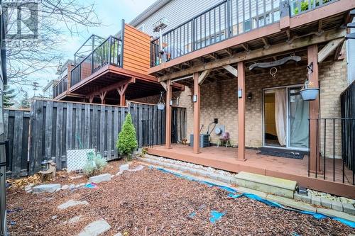 Rear view of house featuring a deck and central AC unit - 1480 Britannia Road W Unit# 143, Mississauga, ON - Outdoor With Deck Patio Veranda