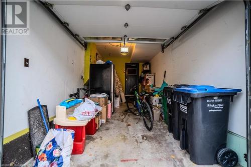 Garage featuring a garage door opener - 1480 Britannia Road W Unit# 143, Mississauga, ON - Indoor Photo Showing Garage