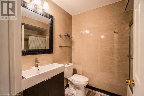 Bathroom featuring vanity, toilet, and tile walls - 1480 Britannia Road W Unit# 143, Mississauga, ON - Indoor Photo Showing Bathroom