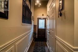 Doorway to outside with dark tile patterned flooring - 