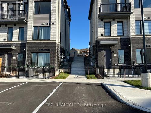 1902 - 160 Densmore Road, Cobourg, ON - Outdoor With Balcony With Facade