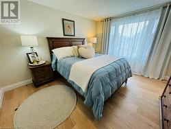 Bedroom with light wood-type flooring - 