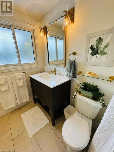 Bathroom featuring tile patterned flooring, vanity, and toilet - 541 Donald Street, Mattawa, ON - Indoor Photo Showing Bathroom