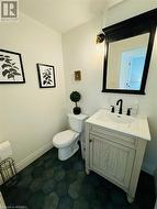 Bathroom with tile patterned flooring, vanity, and toilet - 