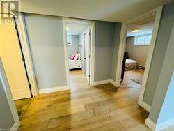 Hallway featuring light hardwood / wood-style flooring - 