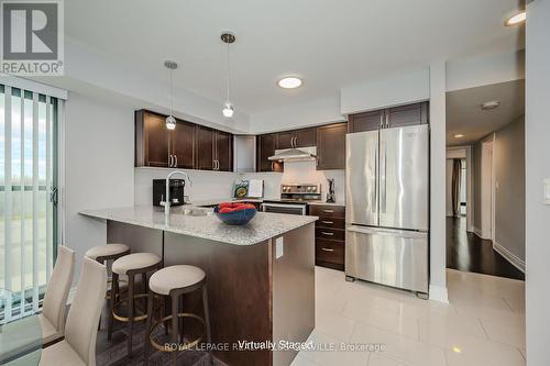 718 - 138 Widdicombe Hill Boulevard, Toronto, ON - Indoor Photo Showing Kitchen With Stainless Steel Kitchen With Upgraded Kitchen