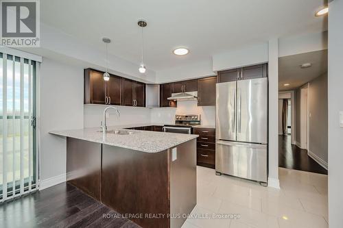 718 - 138 Widdicombe Hill Boulevard, Toronto, ON - Indoor Photo Showing Kitchen With Stainless Steel Kitchen With Upgraded Kitchen