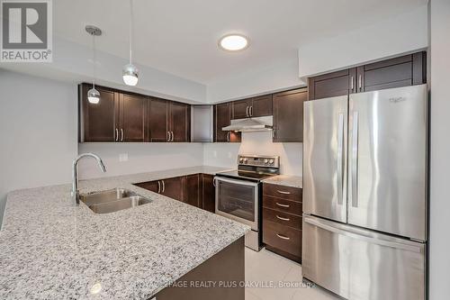 718 - 138 Widdicombe Hill Boulevard, Toronto, ON - Indoor Photo Showing Kitchen With Stainless Steel Kitchen With Double Sink